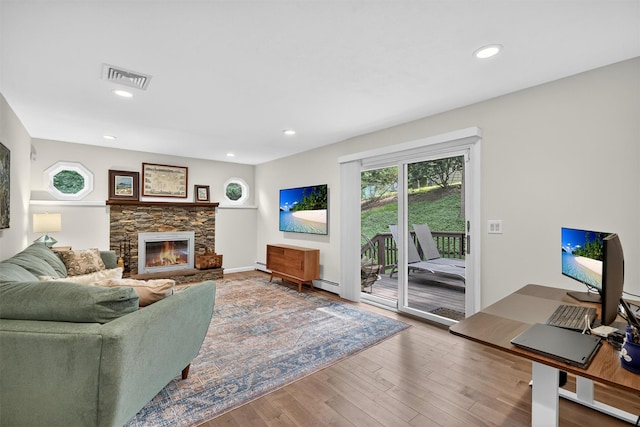 11 Robin Hood Rd, Montebello, NY 10901 - living room with a fireplace, wood finished floors, recessed lighting, and baseboard heating
