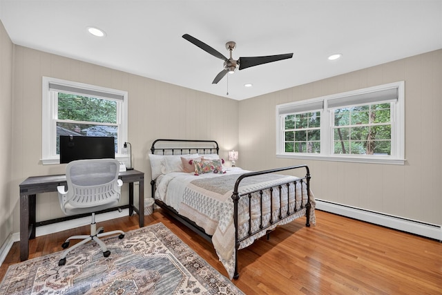 11 Robin Hood Rd, Montebello, NY 10901 - bedroom featuring a baseboard heating unit, wood finished floors, recessed lighting, and ceiling fan