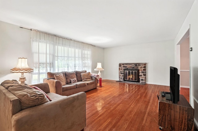 239 Lake St, West Harrison, NY 10604 - living area featuring plenty of natural light, wood finished floors, and a stone fireplace