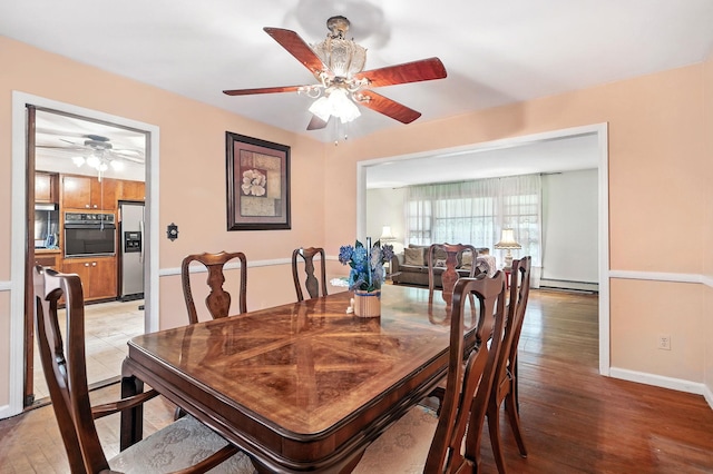 239 Lake St, West Harrison, NY 10604 - dining room with ceiling fan, light wood finished floors, and baseboard heating