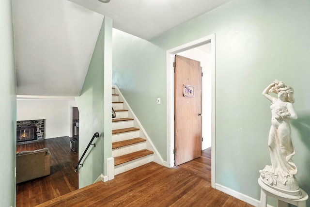 239 Lake St, West Harrison, NY 10604 - staircase featuring wood finished floors and a glass covered fireplace