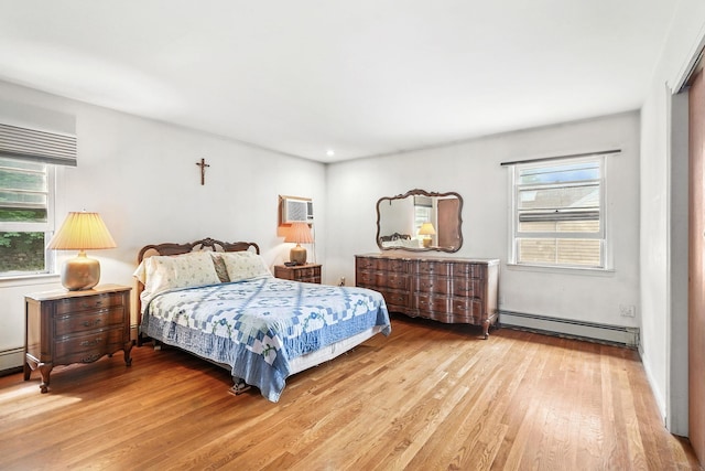 239 Lake St, West Harrison, NY 10604 - bedroom with baseboard heating, wood finished floors, and recessed lighting