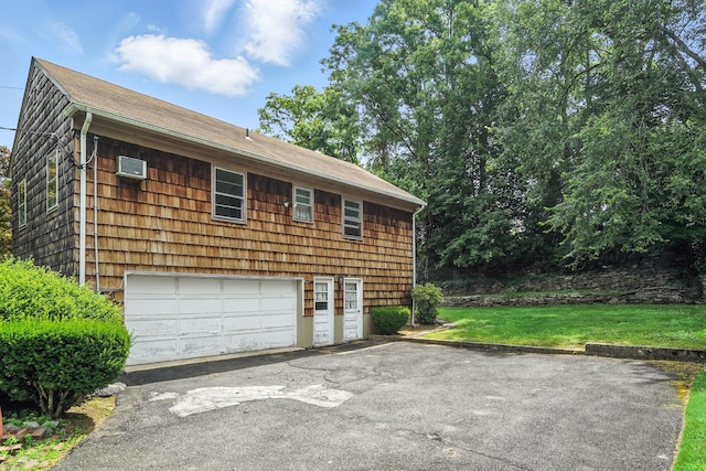 239 Lake St, West Harrison, NY 10604 - garage with asphalt driveway and a wall mounted air conditioner