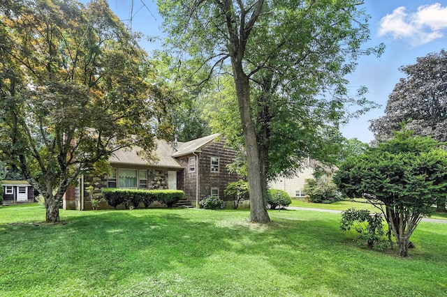 239 Lake St, West Harrison, NY 10604 - view of front of property with a front yard and stone siding