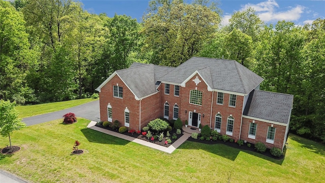 27 Sommerset Dr, Poughkeepsie, NY 12603 - view of front of home featuring brick siding, asphalt driveway, and a front lawn