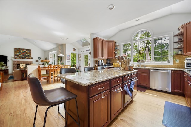 27 Sommerset Dr, Poughkeepsie, NY 12603 - kitchen featuring open shelves, stainless steel dishwasher, vaulted ceiling, light wood-style flooring, and decorative backsplash