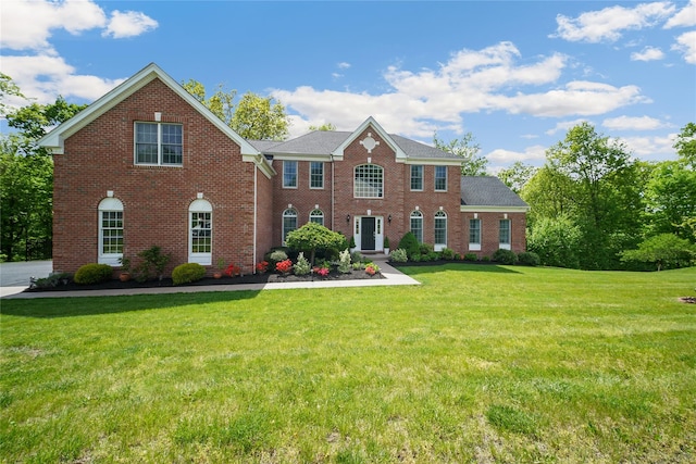 27 Sommerset Dr, Poughkeepsie, NY 12603 - view of front of house featuring brick siding and a front yard