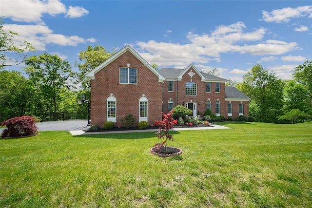 27 Sommerset Dr, Poughkeepsie, NY 12603 - colonial inspired home featuring brick siding and a front yard
