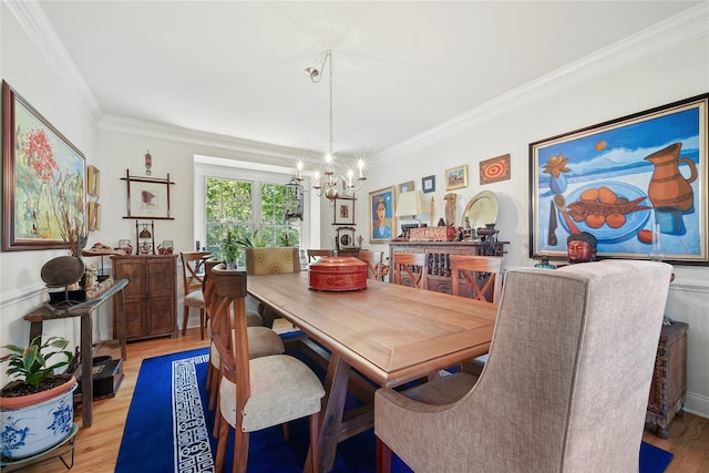 27 Sommerset Dr, Poughkeepsie, NY 12603 - dining area with a chandelier, ornamental molding, and light wood-style flooring
