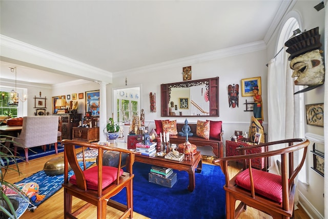 27 Sommerset Dr, Poughkeepsie, NY 12603 - living room with wood finished floors, crown molding, and decorative columns
