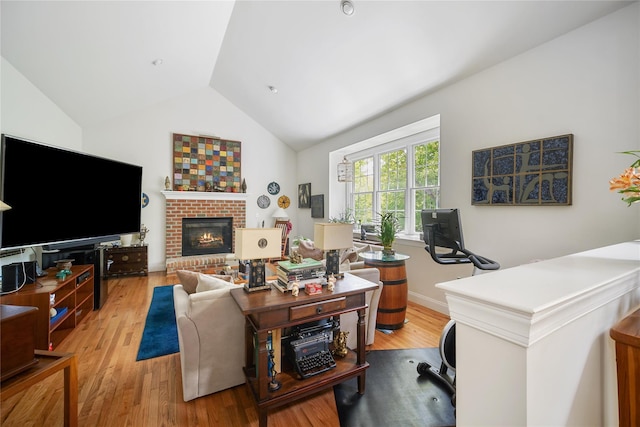 27 Sommerset Dr, Poughkeepsie, NY 12603 - living area with wood finished floors, a brick fireplace, an office area, and high vaulted ceiling