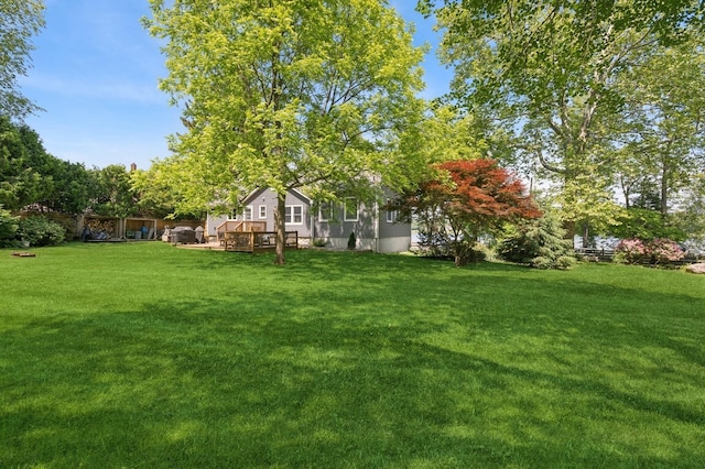 129 W Lakeshore Dr, Carmel, NY 10512 - view of green lawn with a deck