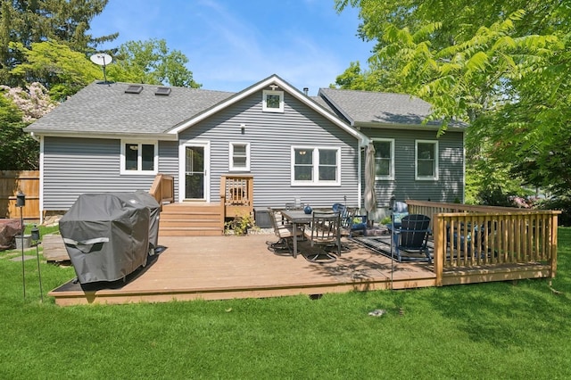 129 W Lakeshore Dr, Carmel, NY 10512 - back of property with a yard, a deck, a shingled roof, and outdoor dining space