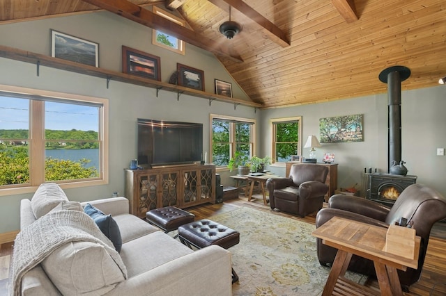 129 W Lakeshore Dr, Carmel, NY 10512 - living room with hardwood / wood-style floors, a wood stove, high vaulted ceiling, and wooden ceiling with exposed beams