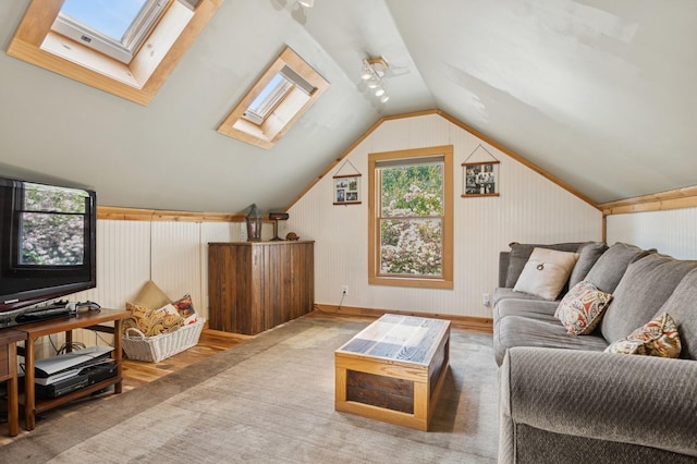 129 W Lakeshore Dr, Carmel, NY 10512 - living area with a skylight, wood finished floors, vaulted ceiling, and wooden walls