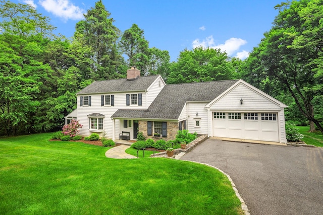 33 High Way, Chappaqua, NY 10514 - view of front facade with driveway, a chimney, a shingled roof, and a front yard