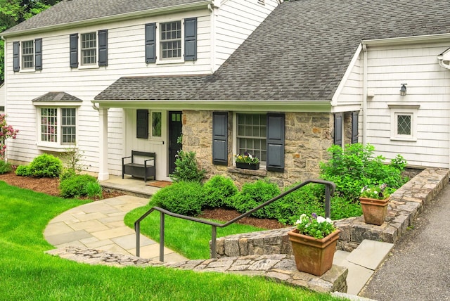 33 High Way, Chappaqua, NY 10514 - view of front of home featuring a shingled roof, stone siding, and a front lawn