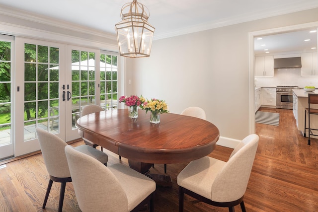 33 High Way, Chappaqua, NY 10514 - dining space with ornamental molding, a chandelier, french doors, light wood finished floors, and recessed lighting