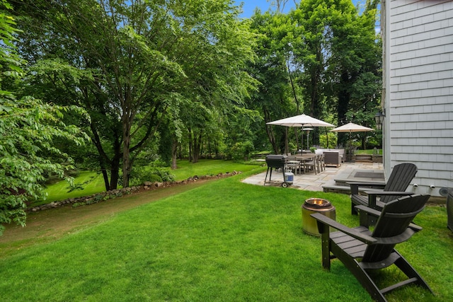 33 High Way, Chappaqua, NY 10514 - view of grassy yard featuring a fire pit, a patio, and outdoor dining space