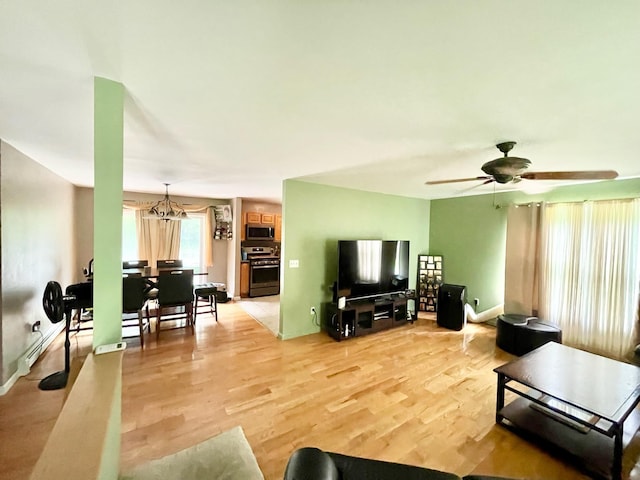 496 Minisink Tpke, Port Jervis, NY 12771 - living room featuring light wood-type flooring, a ceiling fan, and a chandelier