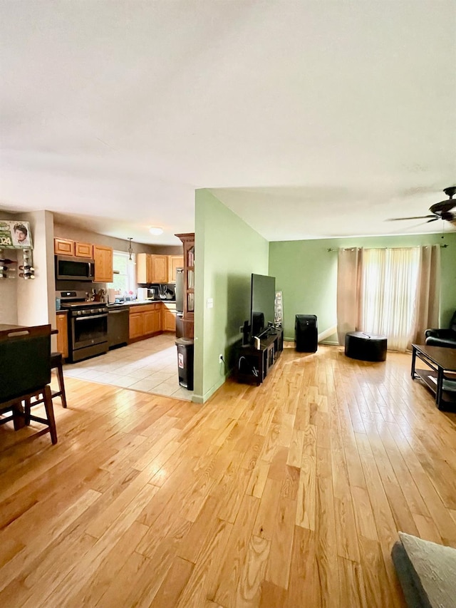 496 Minisink Tpke, Port Jervis, NY 12771 - living area featuring light wood finished floors and a ceiling fan