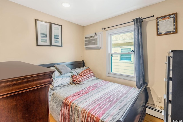 22820 Edgewood Ave, Laurelton, NY 11413 - bedroom with a baseboard heating unit, a wall unit AC, wood finished floors, and recessed lighting