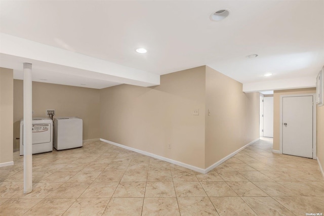 22820 Edgewood Ave, Laurelton, NY 11413 - finished below grade area with recessed lighting, baseboards, light tile patterned floors, and washer and clothes dryer