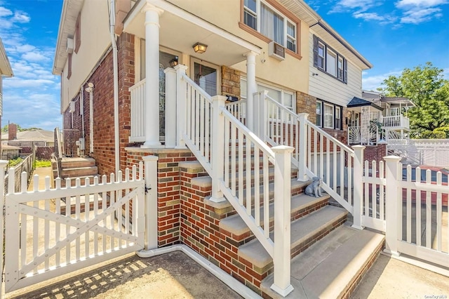 22820 Edgewood Ave, Laurelton, NY 11413 - doorway to property with stone siding, brick siding, and a residential view