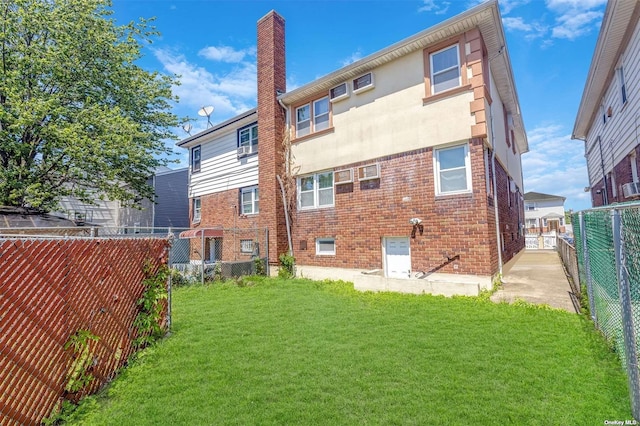 22820 Edgewood Ave, Laurelton, NY 11413 - rear view of property with a chimney and brick siding