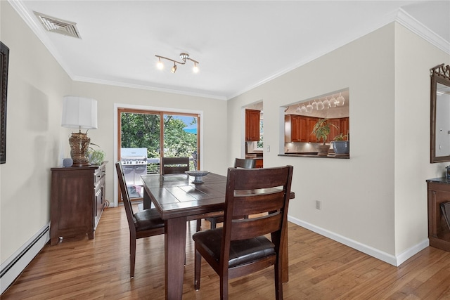 15 Richard Rd, Mahopac, NY 10541 - dining area with a baseboard heating unit, light wood-style floors, and crown molding