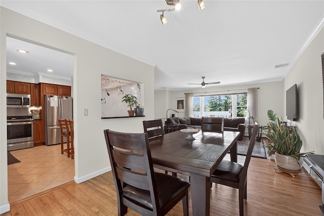 15 Richard Rd, Mahopac, NY 10541 - dining area featuring ornamental molding, light wood-type flooring, and a ceiling fan