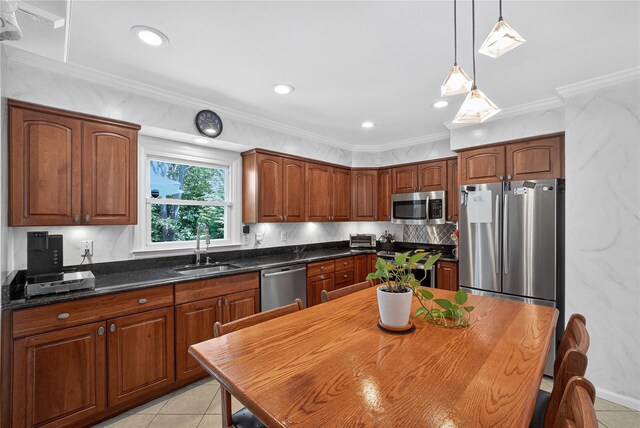 15 Richard Rd, Mahopac, NY 10541 - kitchen featuring appliances with stainless steel finishes, light tile patterned flooring, decorative light fixtures, ornamental molding, and backsplash