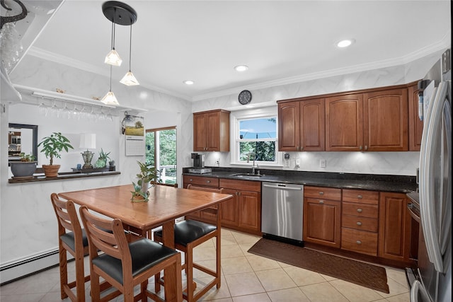 15 Richard Rd, Mahopac, NY 10541 - kitchen with appliances with stainless steel finishes, ornamental molding, light tile patterned flooring, hanging light fixtures, and brown cabinets