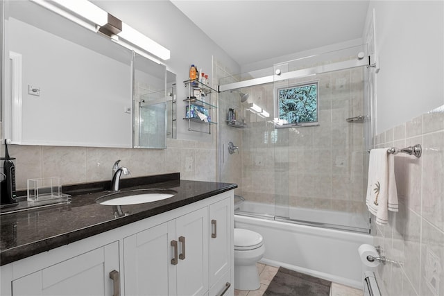 15 Richard Rd, Mahopac, NY 10541 - bathroom featuring tile walls, vanity, enclosed tub / shower combo, and tile patterned floors
