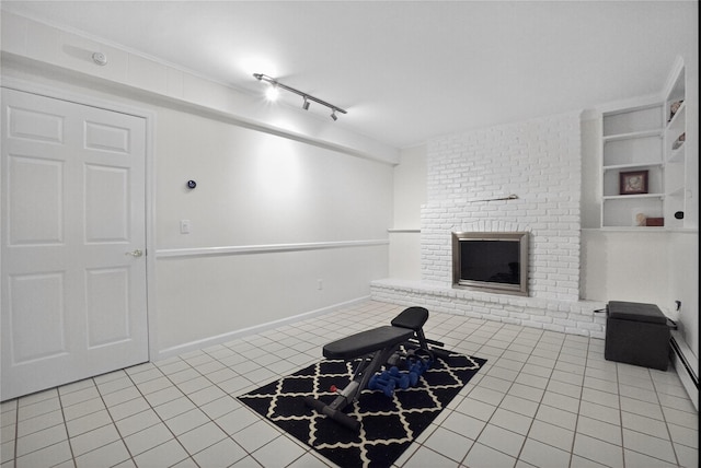 15 Richard Rd, Mahopac, NY 10541 - tiled living room featuring a brick fireplace and track lighting