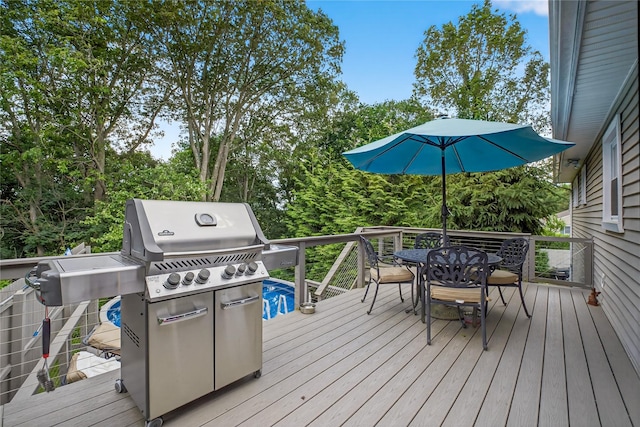 15 Richard Rd, Mahopac, NY 10541 - wooden terrace featuring outdoor dining space, grilling area, and view of scattered trees