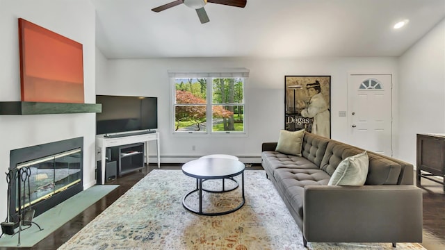 4 Bay View Dr W, Hampton Bays, NY 11946 - living room featuring a fireplace with flush hearth, a ceiling fan, dark wood finished floors, a baseboard heating unit, and recessed lighting