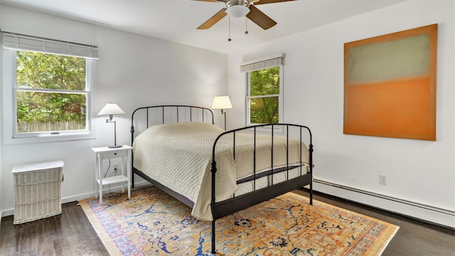 4 Bay View Dr W, Hampton Bays, NY 11946 - bedroom featuring baseboard heating, wood finished floors, and baseboards