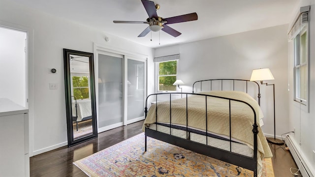 4 Bay View Dr W, Hampton Bays, NY 11946 - bedroom with a baseboard heating unit, dark wood-style floors, baseboards, a ceiling fan, and a closet
