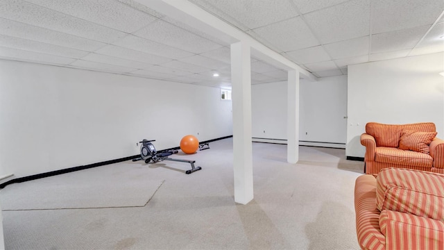 4 Bay View Dr W, Hampton Bays, NY 11946 - finished below grade area with carpet flooring, a paneled ceiling, baseboard heating, and baseboards