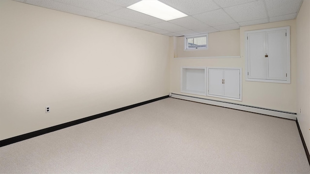 4 Bay View Dr W, Hampton Bays, NY 11946 - carpeted spare room featuring a baseboard radiator, a paneled ceiling, and baseboards