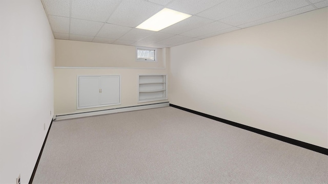 4 Bay View Dr W, Hampton Bays, NY 11946 - unfurnished room with a baseboard radiator, carpet floors, a drop ceiling, and baseboards
