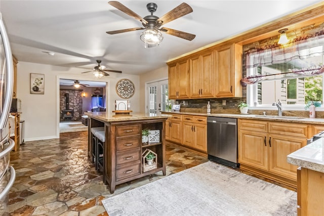 316 Myers Corners Rd, Wappingers Falls, NY 12590 - kitchen featuring dishwasher, a sink, a wood stove, open shelves, and a ceiling fan
