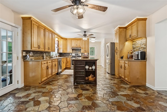 316 Myers Corners Rd, Wappingers Falls, NY 12590 - kitchen with appliances with stainless steel finishes, stone flooring, ceiling fan, tasteful backsplash, and open shelves