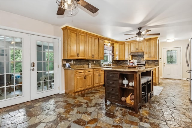 316 Myers Corners Rd, Wappingers Falls, NY 12590 - kitchen featuring a ceiling fan, stone floors, backsplash, and french doors