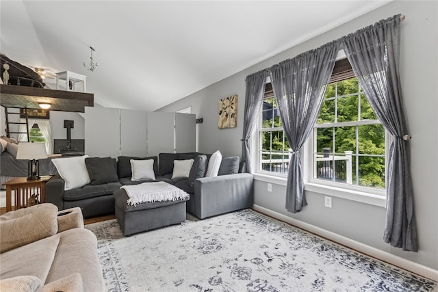 316 Myers Corners Rd, Wappingers Falls, NY 12590 - living area featuring healthy amount of natural light, a wood stove, baseboards, and lofted ceiling