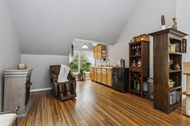 316 Myers Corners Rd, Wappingers Falls, NY 12590 - bar featuring lofted ceiling, hardwood / wood-style floors, a sink, dishwashing machine, and fridge