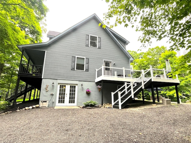 316 Myers Corners Rd, Wappingers Falls, NY 12590 - back of house with stairs, french doors, a deck, and stucco siding