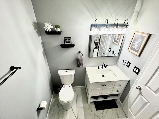 316 Myers Corners Rd, Wappingers Falls, NY 12590 - half bath with marble finish floors, toilet, baseboards, and vanity