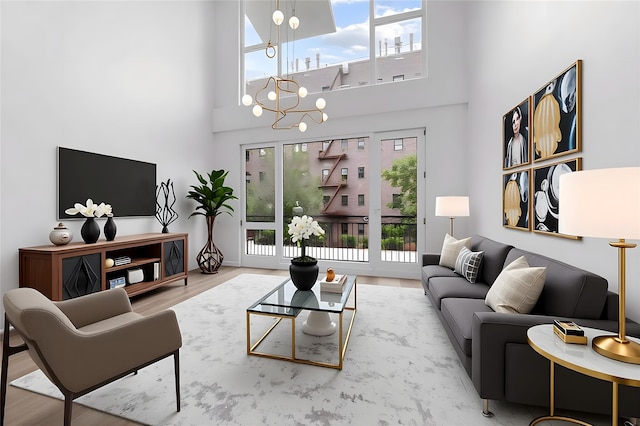312 Fenimore St, Brooklyn, NY 11225 - living room with a high ceiling, wood finished floors, and a chandelier